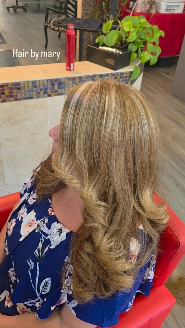 Long blonde balayage with loose curls, hair by Mary