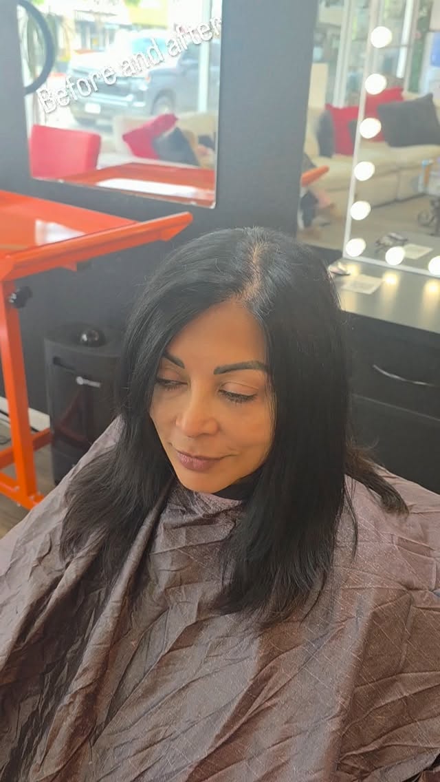 Sleek dark shoulder-length cut finished in the salon chair