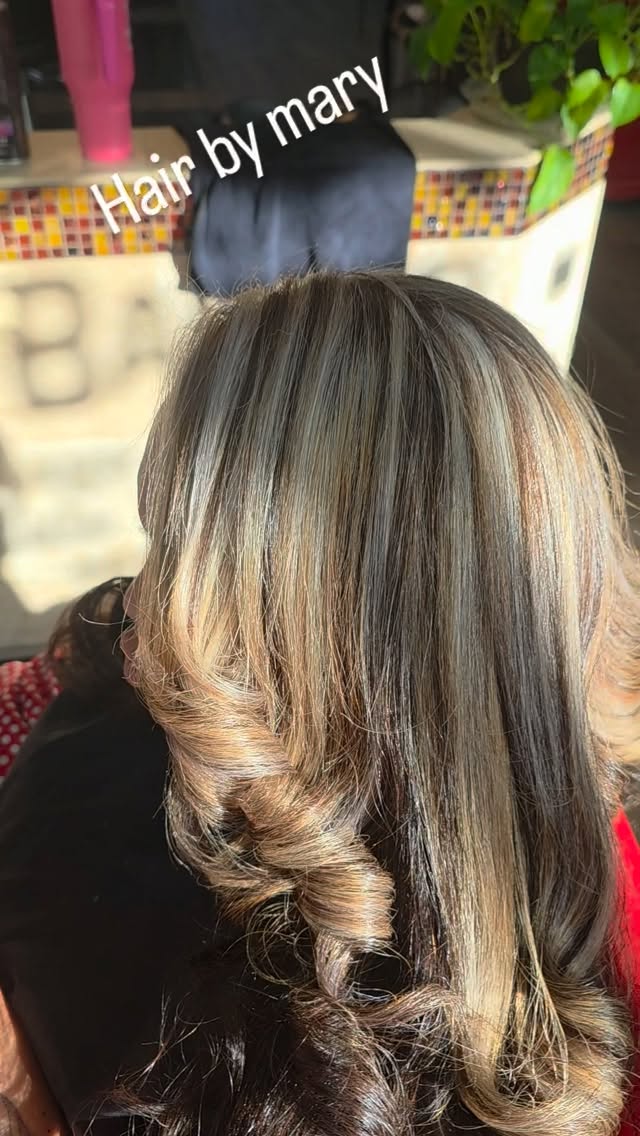 Blonde balayage with shadow roots, curled and styled