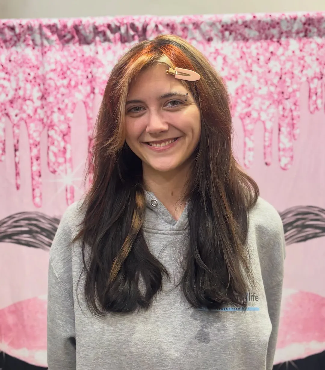 Client with long dark brown hair after a cut and style